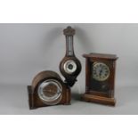 An American shelf clock with glass door, an oak cased mantel clock and an oak cased barometer