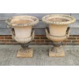 A pair of terracotta campana garden urns, by A M Blashfield, both with stamped marks dated 1868, 24"