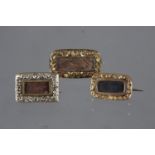Three 19th century yellow metal mourning brooches