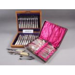 Eleven mother-of-pearl and silver plated dessert knives and forks, in oak case, a cased set of