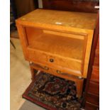 A 1950s maple bedside table, fitted one drawer, stamped "F Rattie", on splayed supports, 22" wide