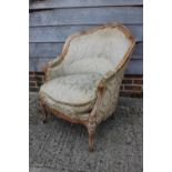 A Louis XVI design carved walnut showframe armchair, on cabriole supports