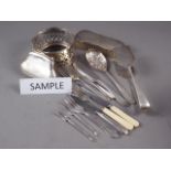 A silver plated wine bottle coaster, a plated coin purse, a brush and a quantity of loose plated