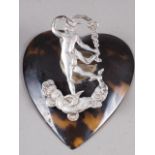 A heart-shaped tortoiseshell and silver mounted letter clip, formed as Mercury