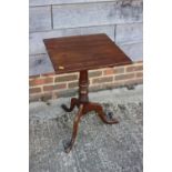 An early 19th century fruitwood square tilt top occasional table, on turned column and tripod