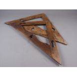 Two Masons 18th century oak set squares, larger 20" long