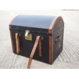 An early 20th century canvas and leather dome top trunk, 24" wide x 17" deep x 21" high
