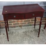 A mahogany serpentine front side table, fitted two drawers, 31" wide x 13" deep x 29" high