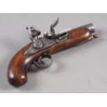 An early 19th century flintlock pocket pistol with beech stock, barrel 4" long