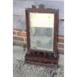 An early Georgian mahogany toilet mirror, on plateau base, fitted three drawers, on bracket feet,