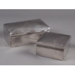 A silver two-section cigarette box and another smaller cigarette box