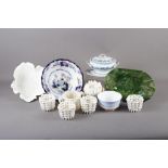 Four white glazed ceramic baskets, a similar vase with relief flower decoration, 4 1/2" high, a