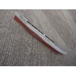 A painted scratch built radio controlled battle ship hull, 63" long