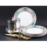 A silver plated Pelican Ware Egyptian style biscuit box, six Kensington plates and a brass