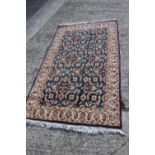 A Caucasian style rug with all-over floral design on a blue ground, 37" x 64" approx, a similar