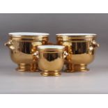 A pair of gilt porcelain cache pots, 8 1/2" dia x 8" high, and another similar 6" dia x 5 3/4" high