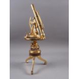 A reproduction Burke & Jones brass theodolite, on tripod supports, 12 1/4" high