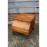 A 19th century figured mahogany commode stool with liner, on turned supports, 16" wide x 20" deep