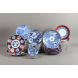 A set of four Japanese blue and white stencilled plates, 8" dia, and a number of similar plates,