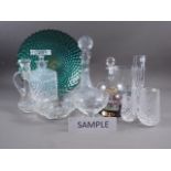 A pair of ship's decanters, a cut glass claret jug and other cut glass bowls, sundaes, etc