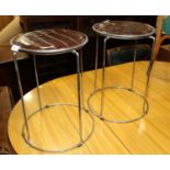 A pair of chrome circular stools, upholstered in a mock crocodile fabric, 17 1/2" high