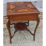 An Edwardian rosewood, marquetry and line inlaid two-tier envelope card table with drawer, on