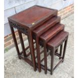 A nest of four Chinese carved rosewood occasional tables, largest 17 1/2" wide x 13" deep x 26" high