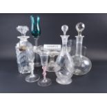 Six clear glass decanters, a cake stand, a green glass and twisted stem wine, 13" high, two other