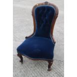 A 19th century mahogany showframe chair, button upholstered in a blue velour, on cabriole supports