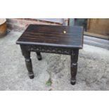 An oak rectangular stool with carved frieze, on turned supports, 18" wide x 12" deep x 16" high