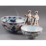 Two Chinese Imari pattern bowls (damages) and a pair of Japanese figures, 8" high