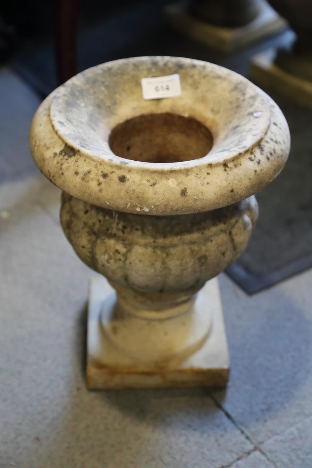 A marble urn with flared rim, 12" high