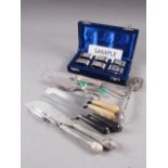 A selection of silver plated flatware and a cased set of six plated napkin rings