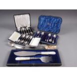 A cased set of six silver teaspoons, a cased set of six silver coffee spoons, a cased set of six