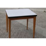 A 1960s Formica top draw leaf table, on splay supports, 30" wide x 24" deep x 30" high