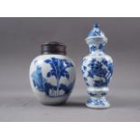 A Chinese blue and white bulbous jar, decorated figures in a landscape, with associated hardwood
