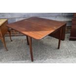 A Georgian mahogany drop leaf dining table, on moulded chamfered supports, 37" wide x 15" deep x