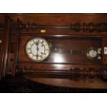 An American cased wall clock with glazed panels and eight-day striking movement, 42" high