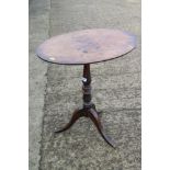 A 19th century mahogany oval top occasional table, on turned column and tripod splay support, 23"