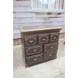 A Middle Eastern hardwood and brass mounted chest of three short drawers over four medium drawers