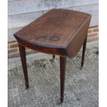 A late Georgian mahogany Pembroke table, on square taper castored supports, 37" wide x 32" deep x 28