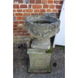 An antique cast stone planter with swag decoration, on square base, 29" high