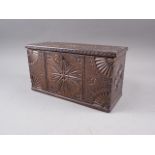 An 18th century carved oak marriage box, inscribed "Accept this trifle - from a friend whose love