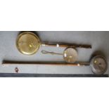 A brass warming pan, a brass warming pan and a brass cream skimmer