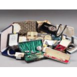 A number of silver necklaces, bracelets, brooches, etc, a cased dressing table set, a cased sewing