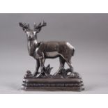 A burnished steel "stag" door stop, 8 1/2" high