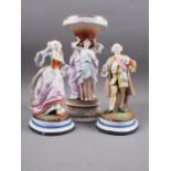 A pair of 19th century Continental bisque figures, dressed in period costumes, 9" high, and a