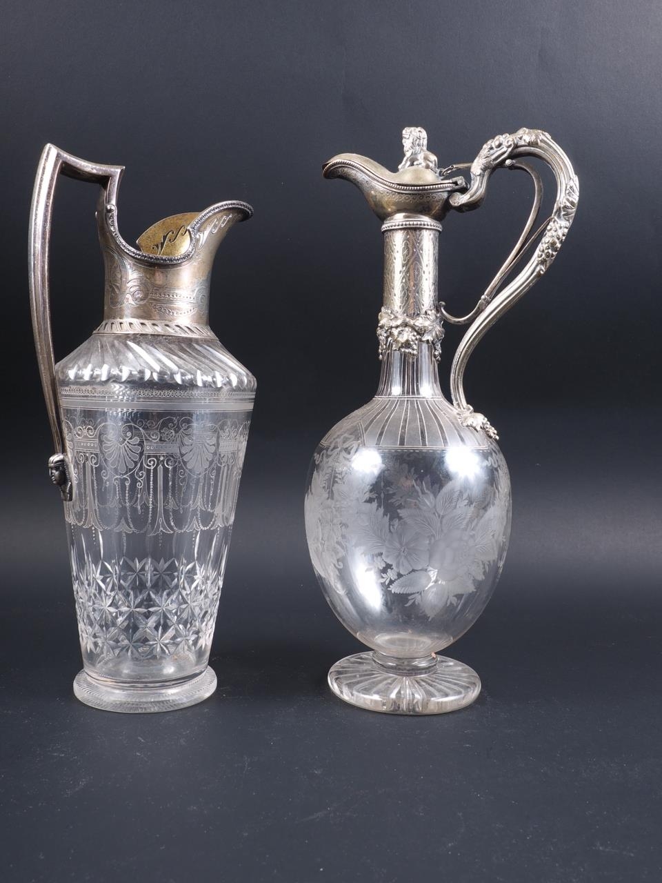 A late 19th century silver mounted claret jug with shell engraved decoration, 11 1/2" high (chip