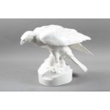 A Continental porcelain white glazed model of an eagle, stamped "C Grazer", 12" high (chip to beak)