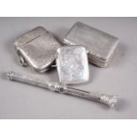A silver snuff box with engraved decoration, two silver vesta cases and a silver cased dip pen and
